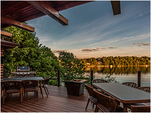 Hickory Hills (link) picture shows covered deck with tables, grill, and gas firepit. Views of the lake at sunset.