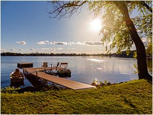 Lakeside Get-Away (link) picture shows lake with pier and boats. View at sunset.